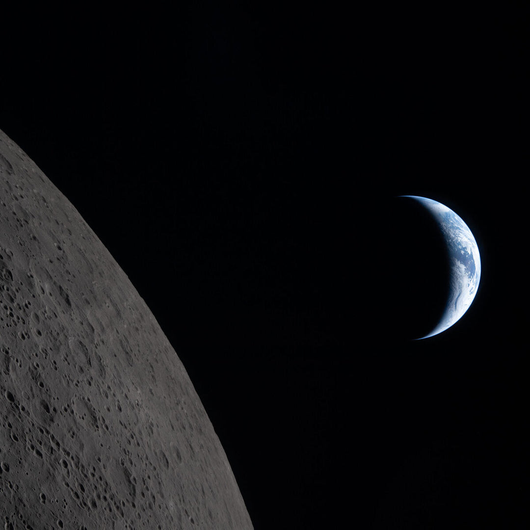 A crescent Earth about to set behind the Moon photographed by the Artemis II crew six minutes before Earthset